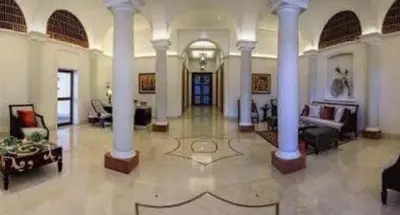 a large room with columns and a living room at 1BR Near Beach, Airport & In City of Manila Bay in Manila