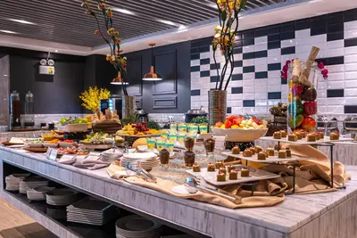 a buffet line with food on a table at Coro Hotel in Manila