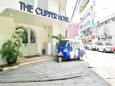 a small blue car parked in front of a building at The Clipper Hotel, Poblacion Makati in Manila