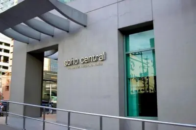 a building with a sign on the side of it at MANDALUYONG 2 Br w 2 Queen, 50HDtv across Shangrila Mall in Manila