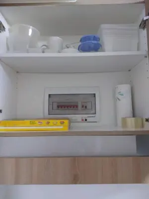 a microwave sitting on a shelf in a refrigerator at Jones Shore Residences in Manila