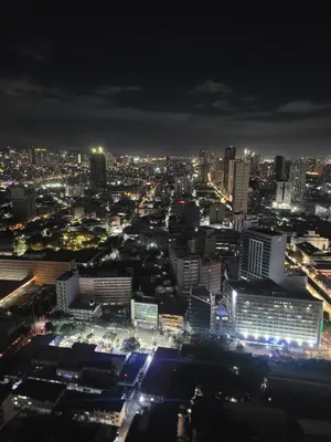 a view of a city at night at Juja's place in Manila