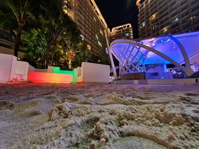 a roller coaster in a city at night at Manila Urban Resort at Azure in Manila