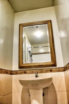 a bathroom with a sink and a mirror at CENTROPOLIS 1, Relax & Chill in Manila