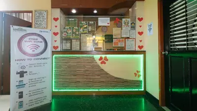 a room to camera with a window with a sign at RedDoorz near SM City Muntinlupa in Manila