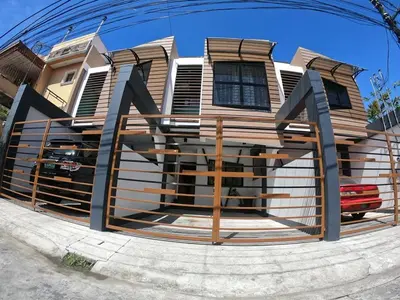 a house with a fence in front of it at Matchi in Manila