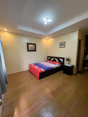 a bedroom with a bed and a wooden floor at INN D’ZaireH in Molino