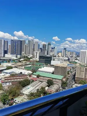 a view of a city with buildings and cars at U607 Sunshine100 Netflix 65InchesTV Wifi Karaoke Swimming Pool in Manila
