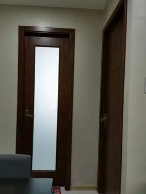 a room with a wooden door and a window at U607 Sunshine100 Netflix 65InchesTV Wifi Karaoke Swimming Pool in Manila