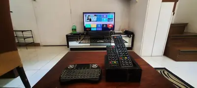 a room with a desk with a computer and a keyboard at BGC Fort Victoria in Manila