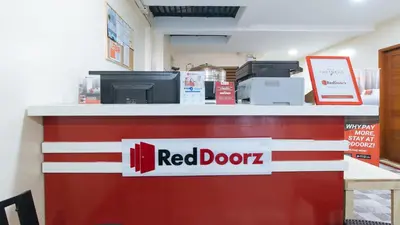 a red dozeracistacistacistacist at RedDoorz Plus near Uptown BGC Mall in Manila