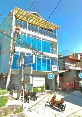 two motorcycles parked in front of a building at Patricios Apartelle Taguig in Manila