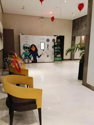 a room with a chair and a wall with hearts at 81 Newport Boulevard Cluster 4 - 8F across NAIA Airport, Terminal 3 in Manila