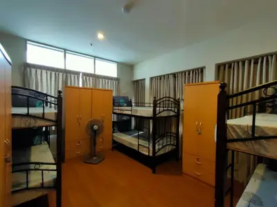 a room with two bunk beds and a window at 538 Dormitel in Manila
