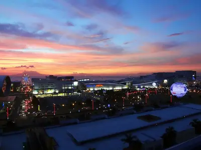 a view of a city at night with lights at manila sea view homes 21 in Manila