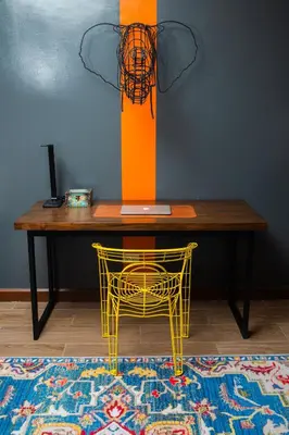 a table with a yellow chair and a table with a lamp at UNWND Flats in Manila