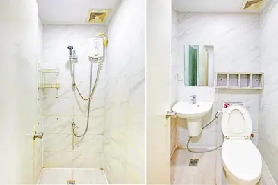 a bathroom with a toilet and a sink at Collection O Metro Manila near University Belt formerly 1318 Residences in Manila