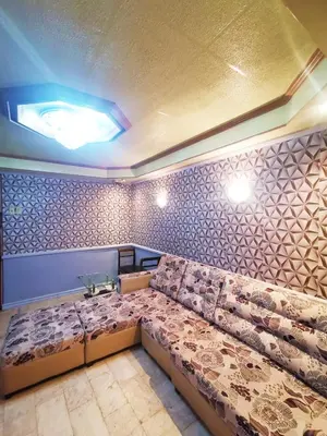 a room with a long couch in a room at Cubao Quezon city Transient condo unit in Manila
