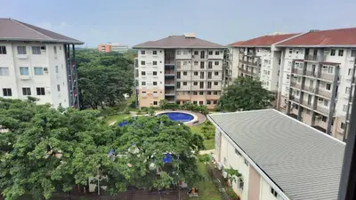 an aerial view of a city with buildings and trees at Amaia Steps Nuvali fully furnished unit with swimming pool view near Carmelray Pitland in Calamba