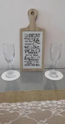 two wine glasses and a sign on a table at Family Suite Staycation FAME Residence 1508 Tower1 in Manila