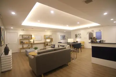a large living room with couches and a dining room at Bryan Condo Suites Makati near Airport in Manila