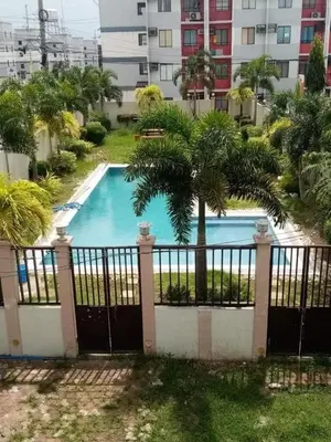 a view of a swimming pool from a balcony at MidKnight Sky Unit for Rent in Anabu Primero