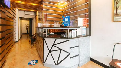 a restaurant with a counter in a room at RedDoorz @ Good 101 Quiricada Manila in Manila