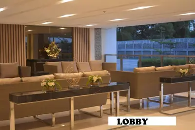 a lobby with couches and tables in a building at Paranaque SM-Sucat Field Res. Bldg 5, 2/F, 2BR with Balcony in Manila