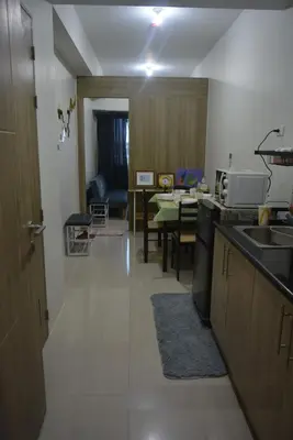 a kitchen with a sink and a dining room at Paranaque SM-Sucat Field Res. Bldg 5, 2/F, 2BR with Balcony in Manila
