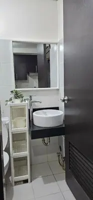 a bathroom with a sink and a toilet at Your Crib - kasara -19 D tower 1 in Manila