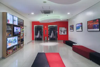 a clothing store with red walls and a red carpet at Red Planet Ortigas in Manila