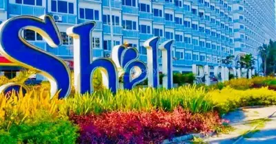 a sign in front of a large building at SHELL RESIDENCE C6 shortwalk MALL OF ASIA in Manila
