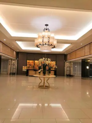 a large lobby with a table and a chandelier at SHELL RESIDENCE c3 shortwalk mall of asia near airport in Manila