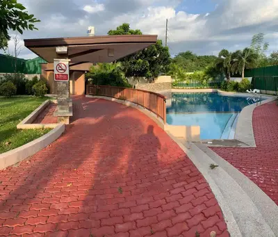 a swimming pool with a no parking sign next to it at At Home Condo With Free Pool Access in Manila