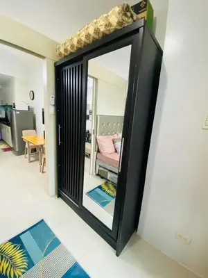 a mirror on a wall in a room at Madison's Place at Sea MOA in Manila