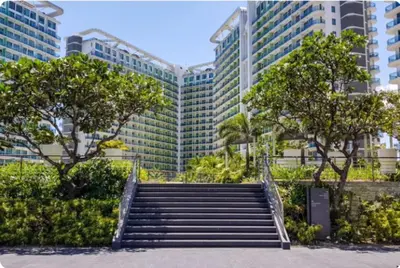 a set of stairs in front of a tall building at AZURE URBAN RESORT - PARANAQUE MANILA NEAR TERMINAL UNLIMITED WIFI and Netflix in Manila