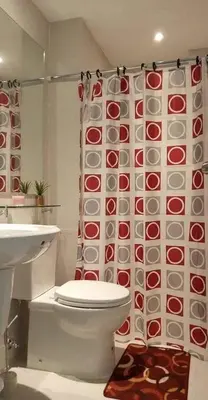 a bathroom with a toilet and a shower curtain at AZURE URBAN RESORT - PARANAQUE MANILA NEAR TERMINAL UNLIMITED WIFI and Netflix in Manila