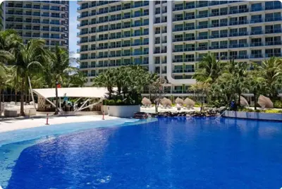 a large pool with blue water in front of buildings at AZURE URBAN RESORT - PARANAQUE MANILA NEAR TERMINAL UNLIMITED WIFI and Netflix in Manila