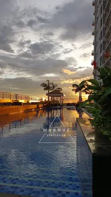 a view of a swimming pool at the beach at SMDC Coast Residences near PICC World Trade Center MOA in Manila