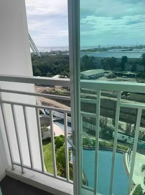 a view of a balcony with a view of the water at Lovely Spacious Condo With Balcony in Manila