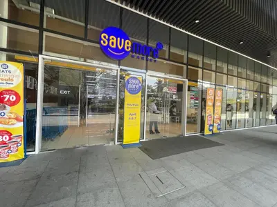 a store front with a savember sign on the door at Condominium Fame Residence in Manila