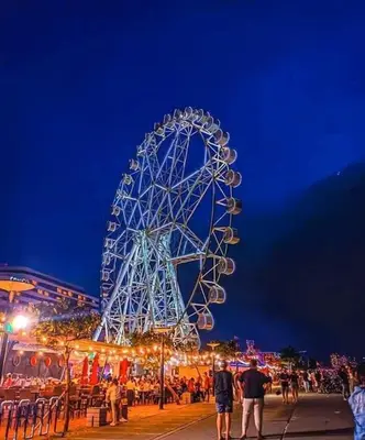 a large ferris wheel at a carnival at night at SHELL RESIDENCE c2 shortwalk Mall of Asia near Airport in Manila