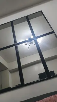 a mirror in a room with a ceiling at Sea Residences EZBedz in Manila