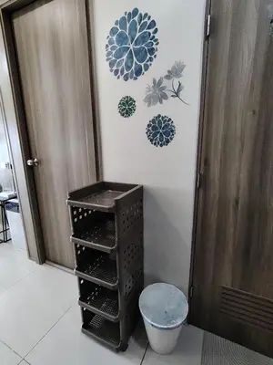 a room with a door and a shelf and a toilet at SMDC Coast Residences - Entire 1BR Condo with stunning view from 24th Floor in Manila