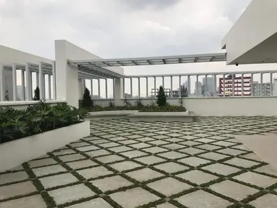 a view of a building with windows and a courtyard at R'Holistay Vista Heights Legarda near CEU San Beda in Manila