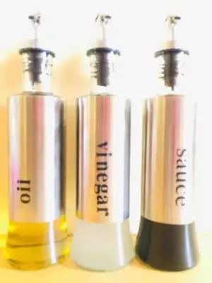 a group of three perfume bottles sitting on a table at R'Holistay Vista Heights Legarda near CEU San Beda in Manila