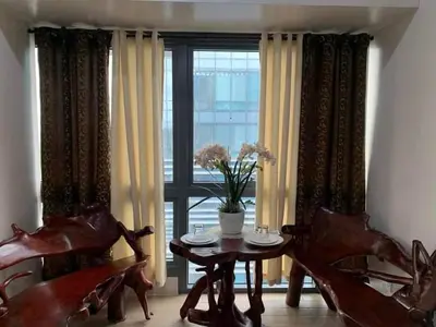 a dining room with a table and chairs and a window at Cozyvilla at 81 Newport Blvd NEWLY RENOVATED walk to NAIA T3 Marriott & Resorts World Casino & Newport Mall for 5 Pax FREE PARKING!!!! in Manila
