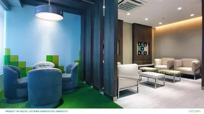 a waiting area with chairs and a waiting room with a waiting room at Uptown Parksuites in Manila