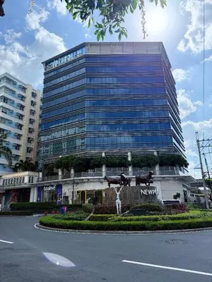 a large building with a statue in front of it at ZG-150Newport in Manila