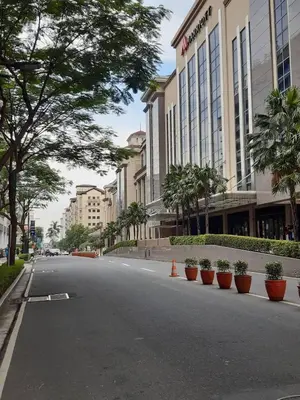 an empty street in front of a building at Sarasota Residential Resort cluster 4 Unit 6B and 6C by Manny Newport Blvd, across NAIA T3 & near Resorts World Manila, Pasay City in Manila